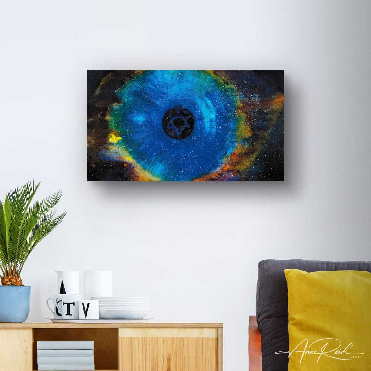 The Apple 2, print – Star of David in Cosmic Blue: Blue nebula abstract painting with Star of David by Anne Reid Artist displayed in a minimalist living room