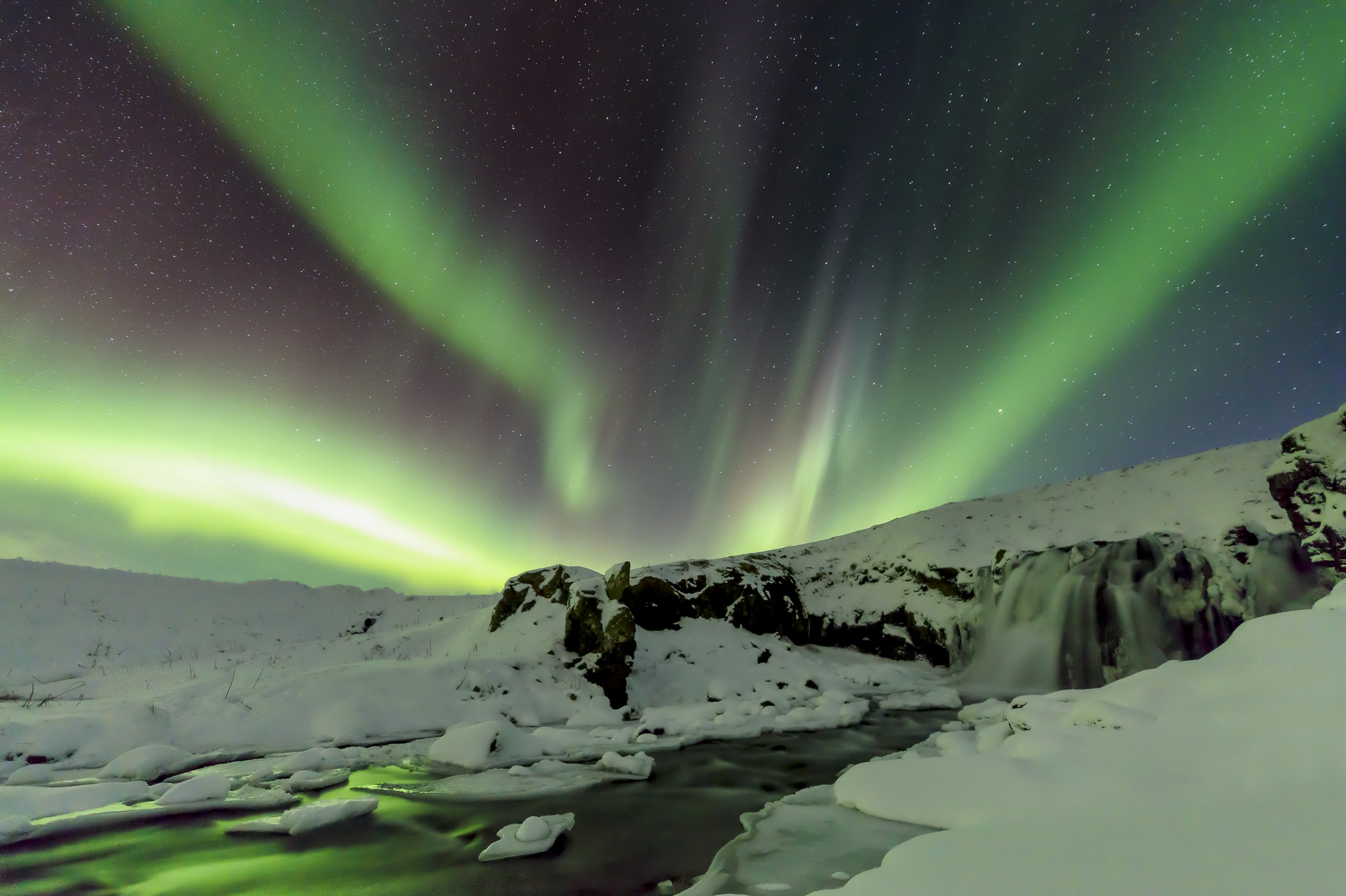 Aurora as breath-loop over ice and water—symbolizing the ankh’s resonance of polarity and life force | Robbie George Photography