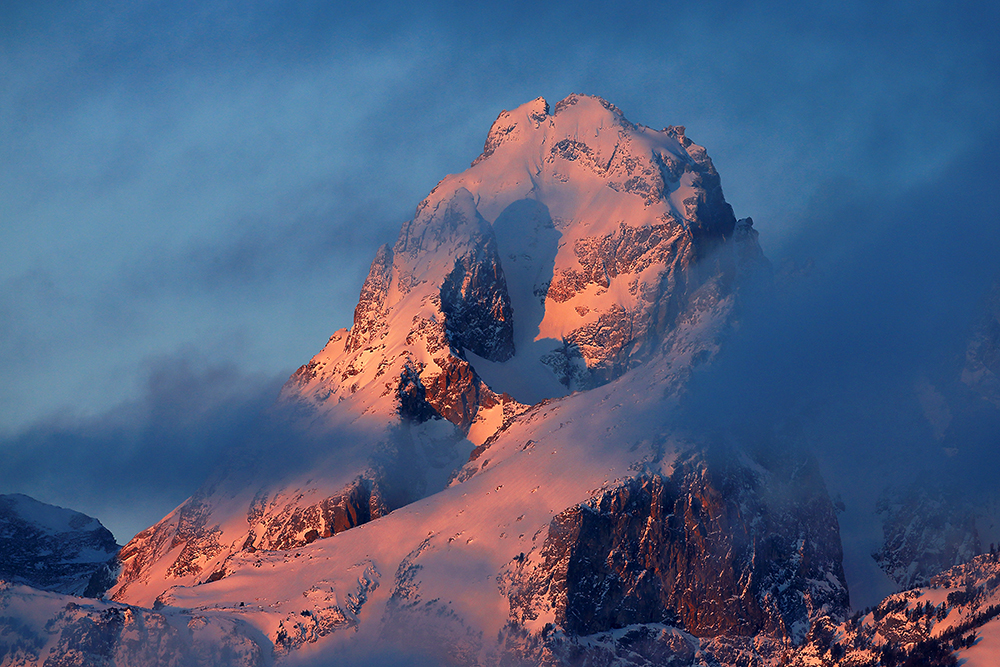 Teton Mountains shrouded in morning mist, symbolizing the probabilistic cloud structure of atoms