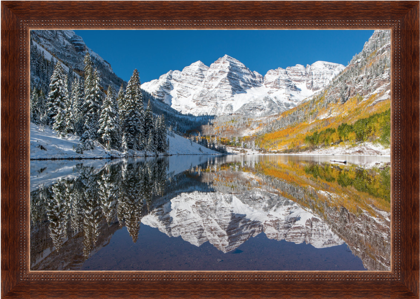 Maroon Bells in autumn and early snow — a reflection of roots, origins, and identity in the Colorado mountains