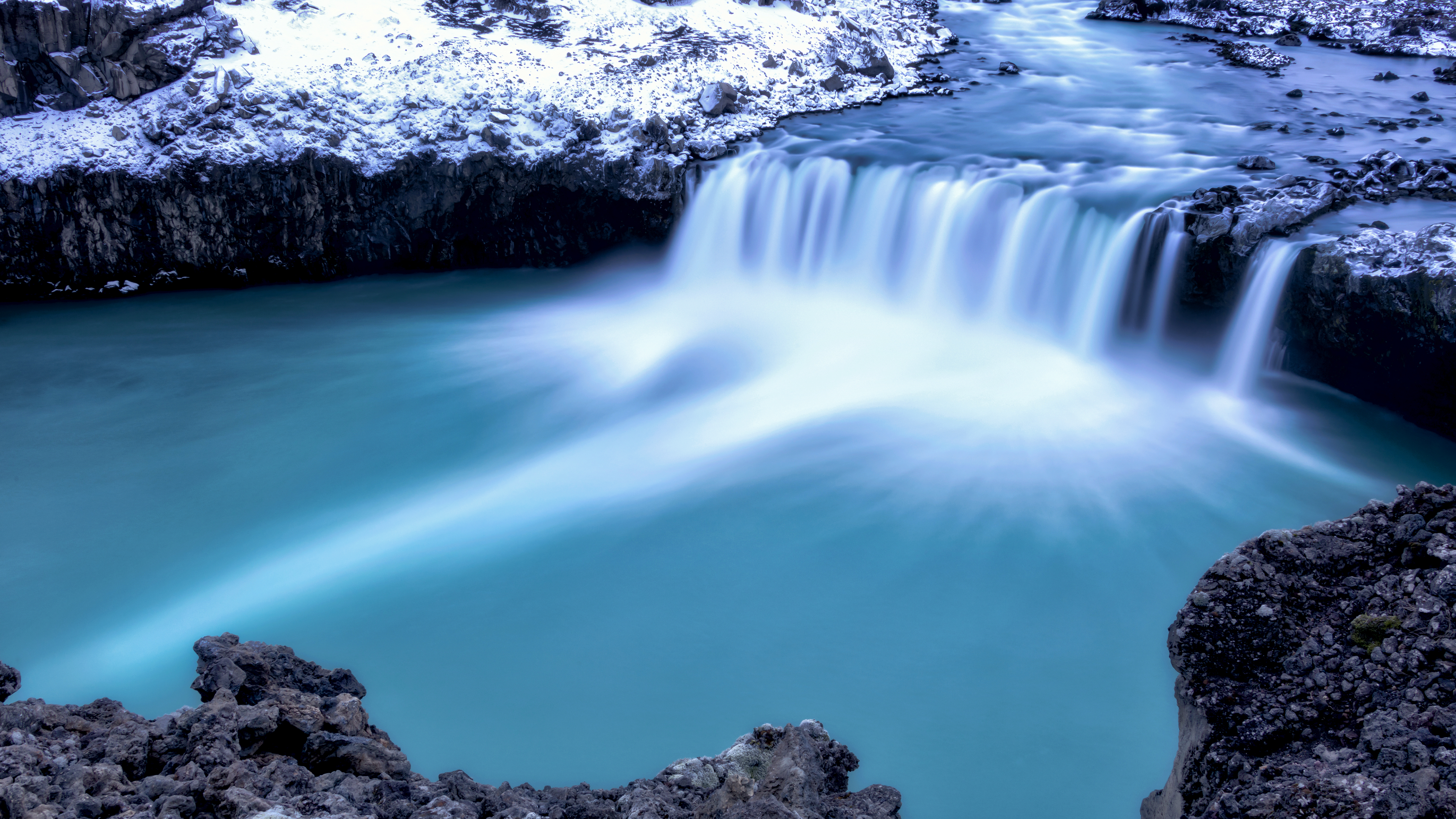 Glacier Ice Water Cascading Over An Icelandic Waterfall
