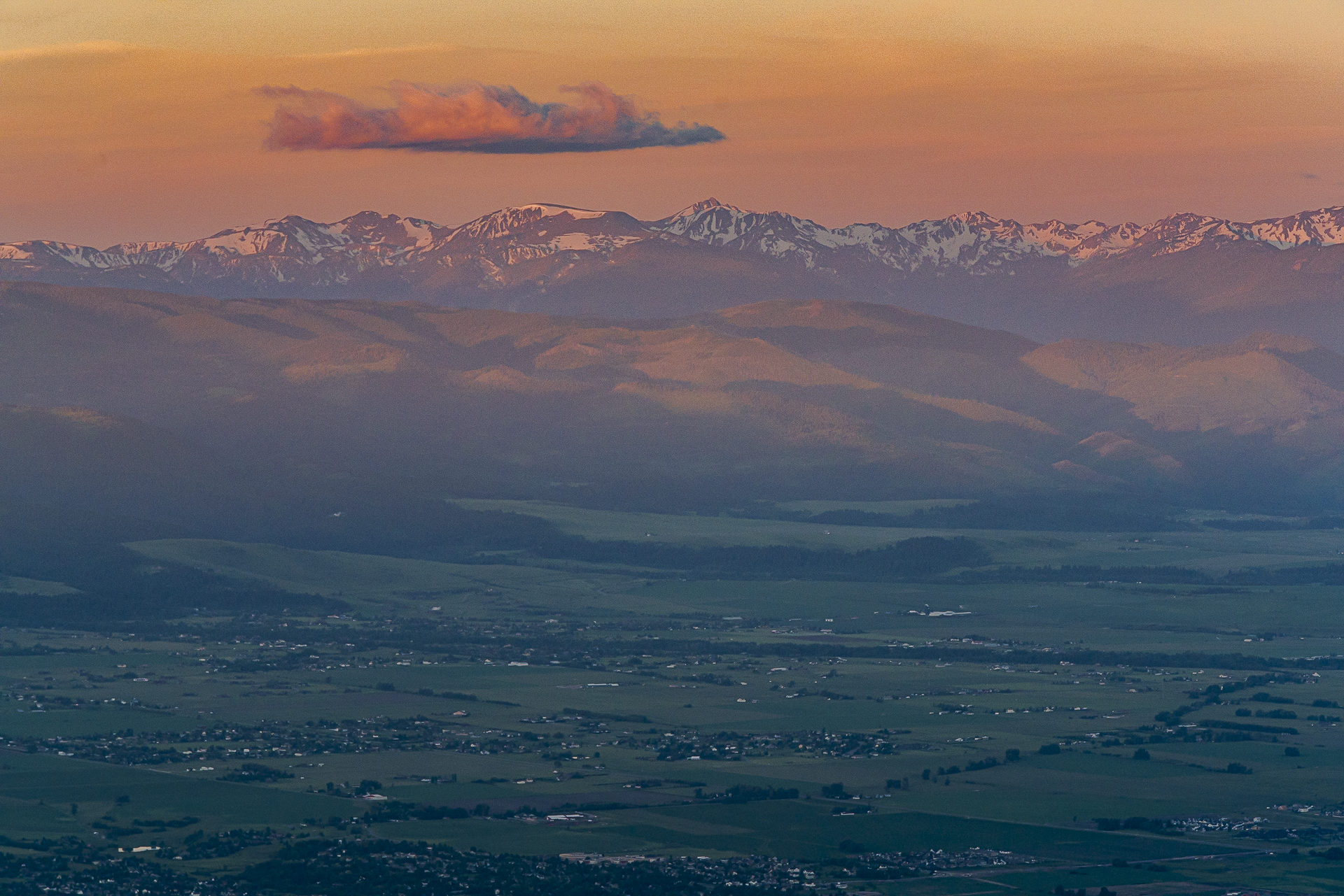 Sunrise over the cities of Bozeman and Belgrade in the Gallatin Valley with the Spanish Peak Mountain Range int he distance.