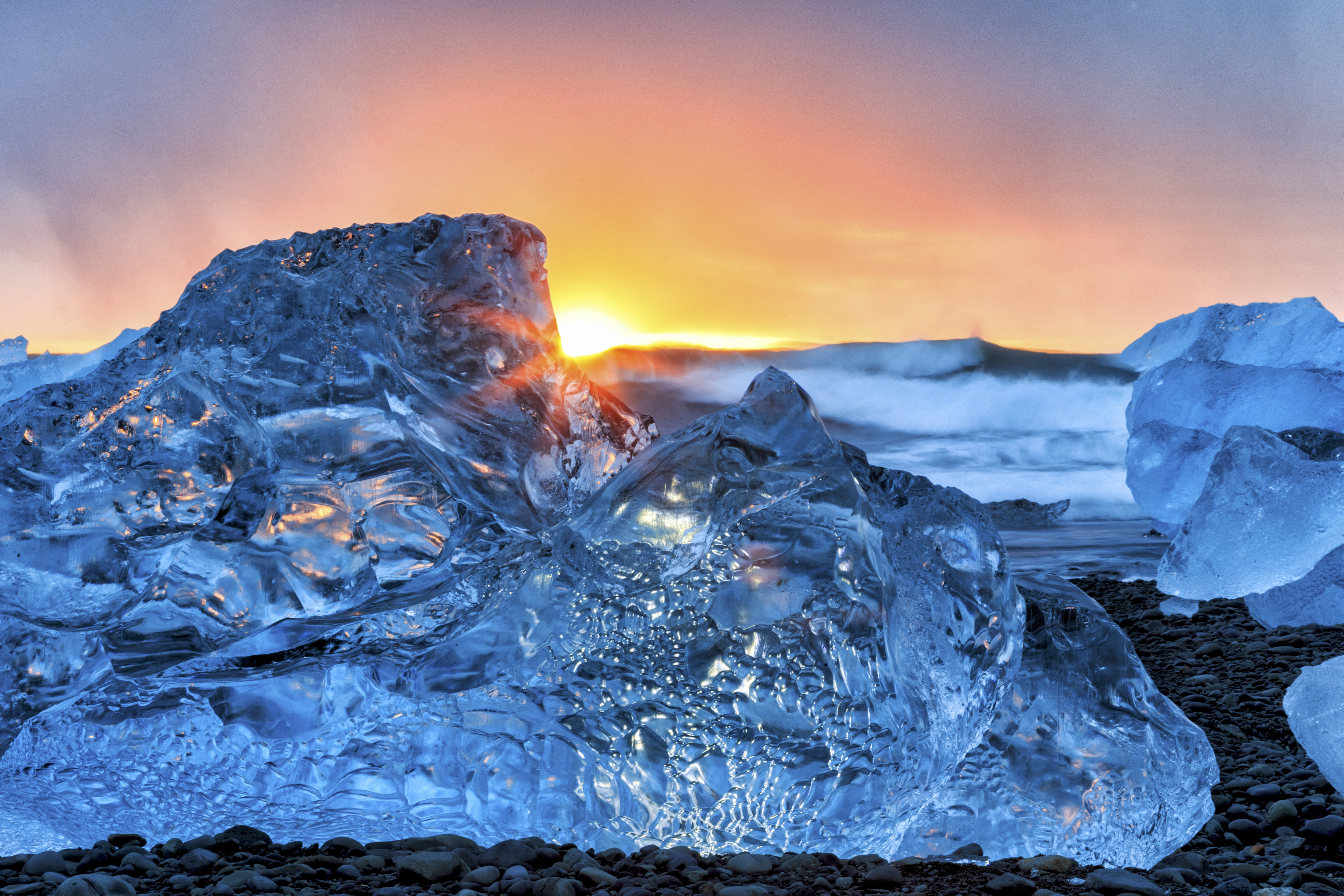 Blue ice glowing against the sea—structured beauty made readable.
