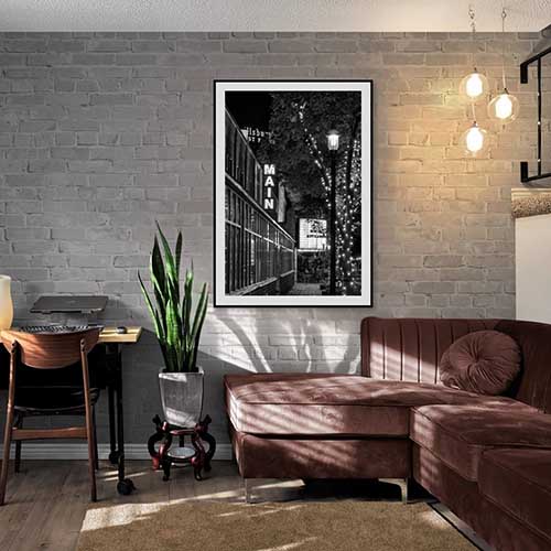 Saint Anthony Main Movie Theater art in black and white on a living room wall.