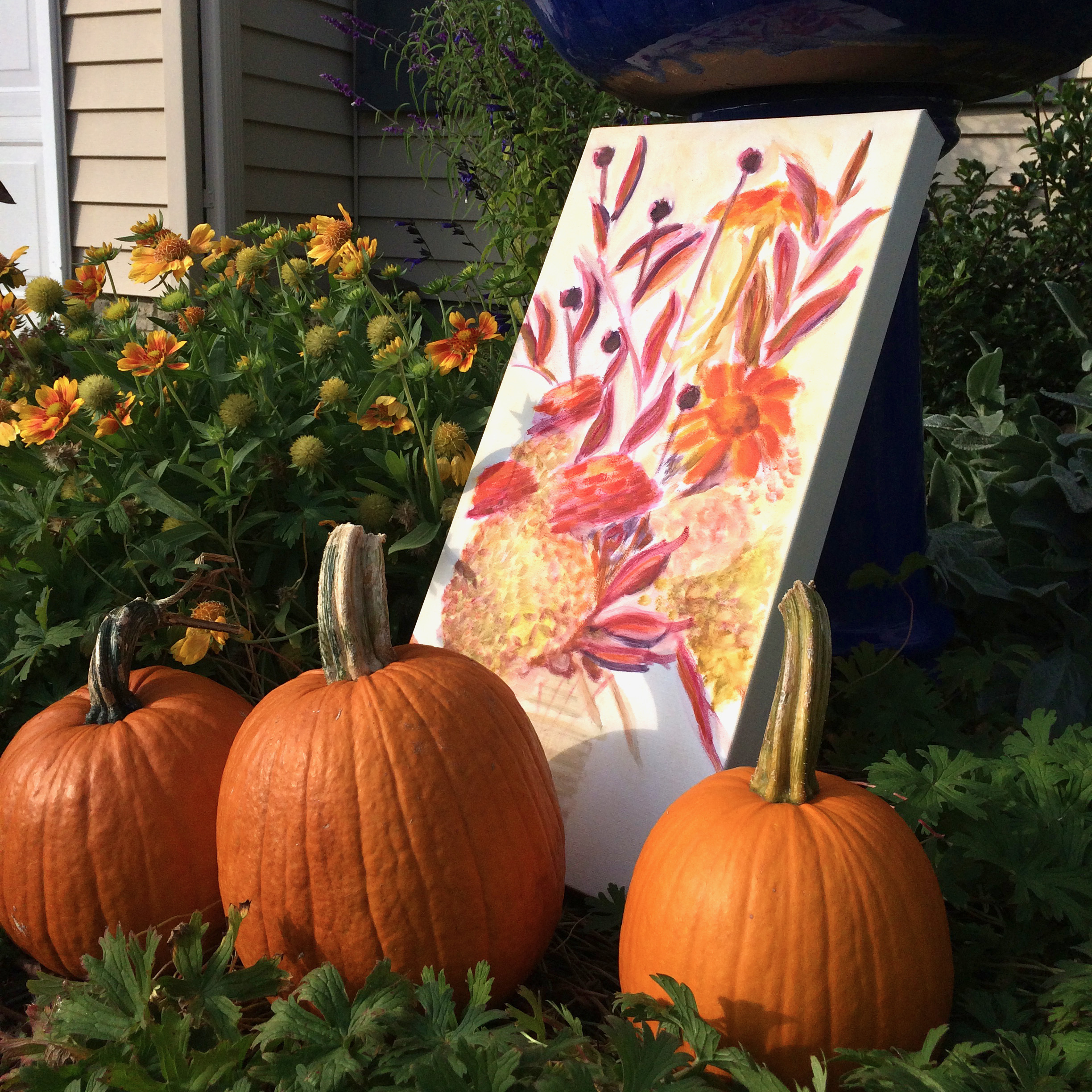 Original oil painting on 10 x 20 inch gallery wrapped canvas featuring a bouquet of orange flowers with orange Zinnias, Fothergilla, Black-Eyed Susans, Gallardia, and Hydrangeas in a vase by Iowa native artist, Marie Stephens 