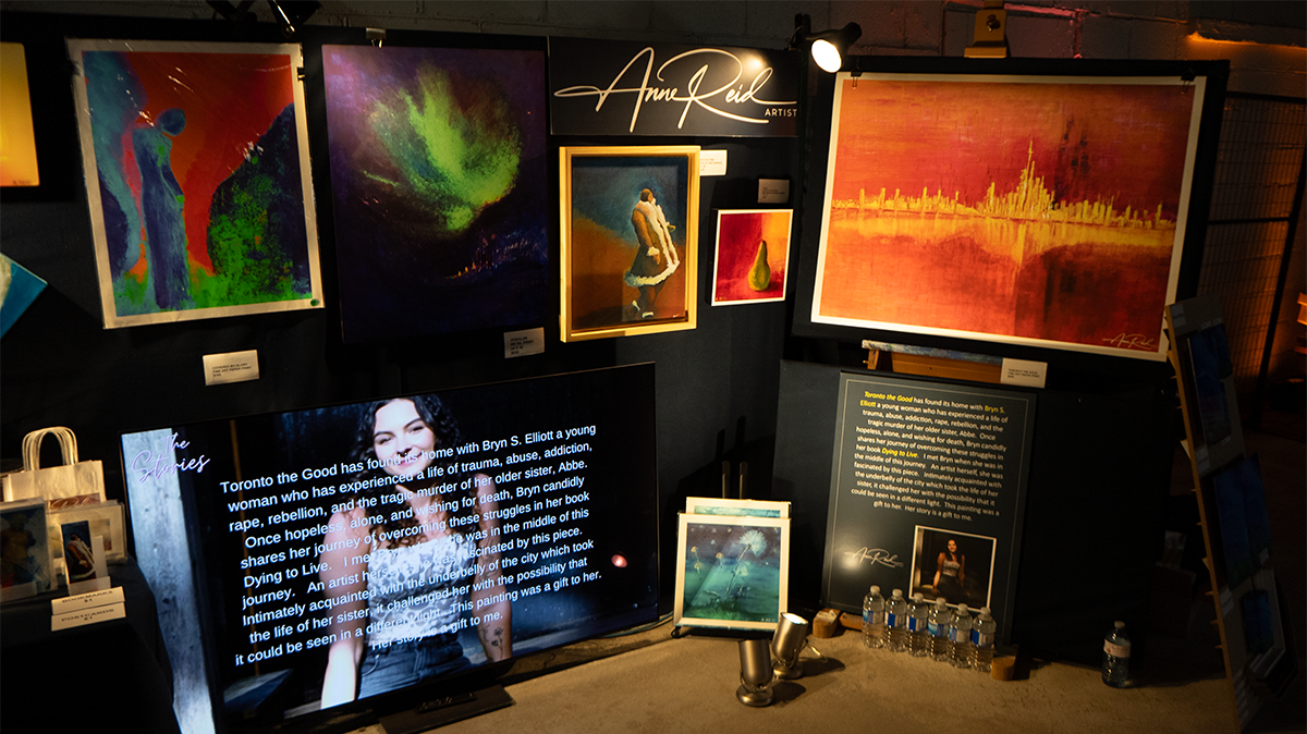 Booth section with Bryn story panel beside featured artwork at RAW Toronto Artshow