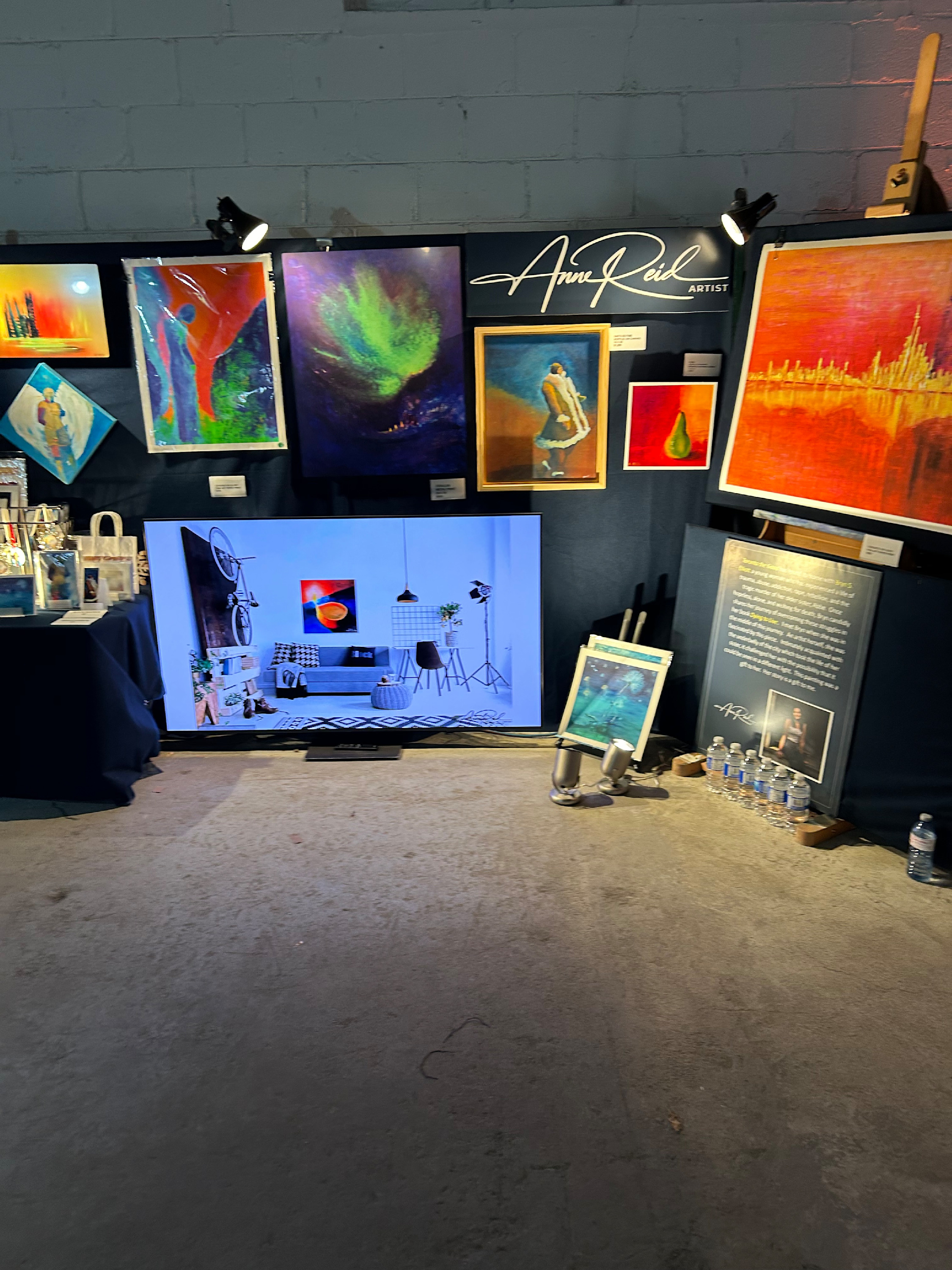 Anne Reid Artist booth at RAW Toronto Artshow with featured works and branding