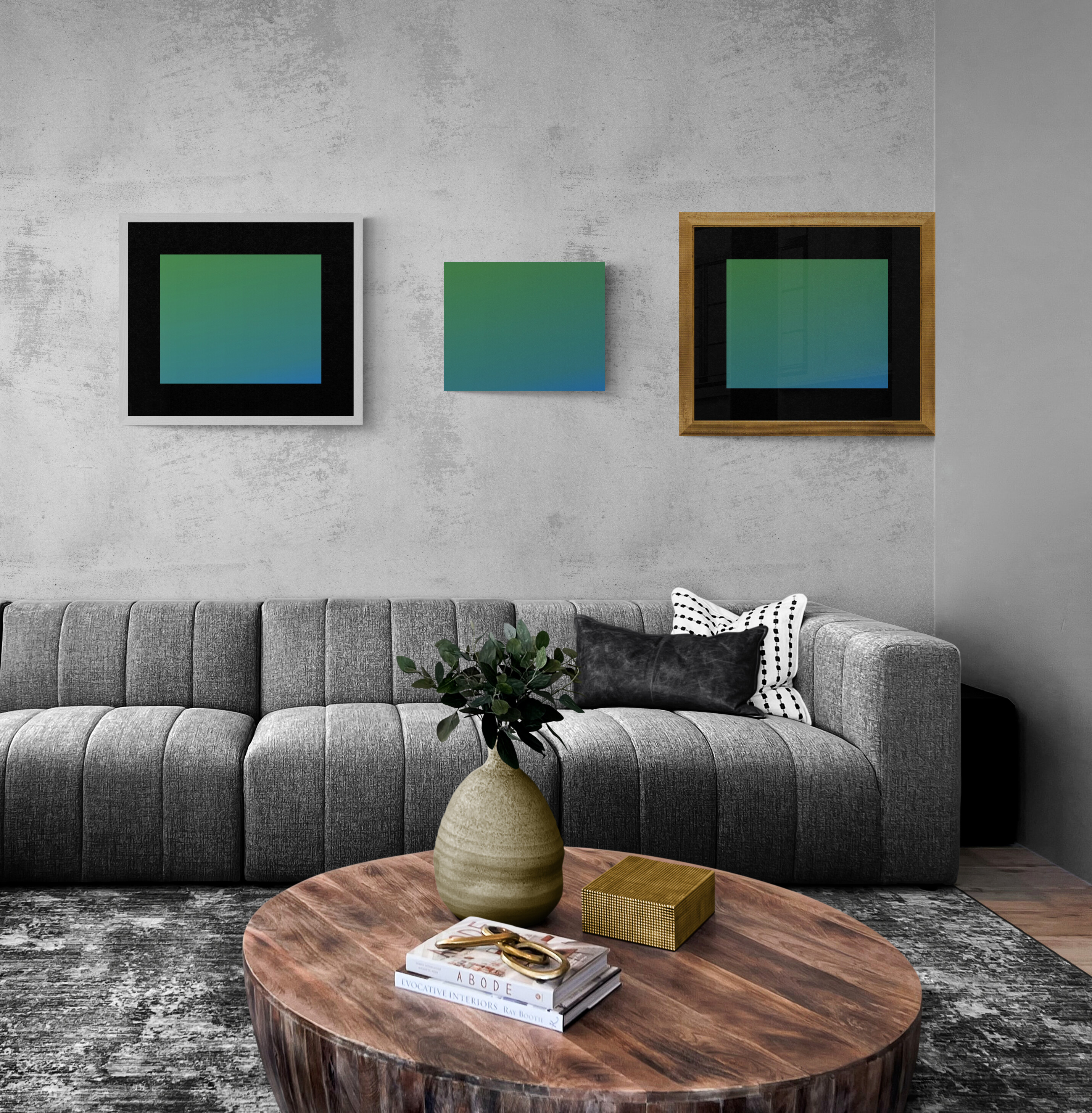 A group of three art pieces. One with a white frame, one with a gold frame, and one with no frame.