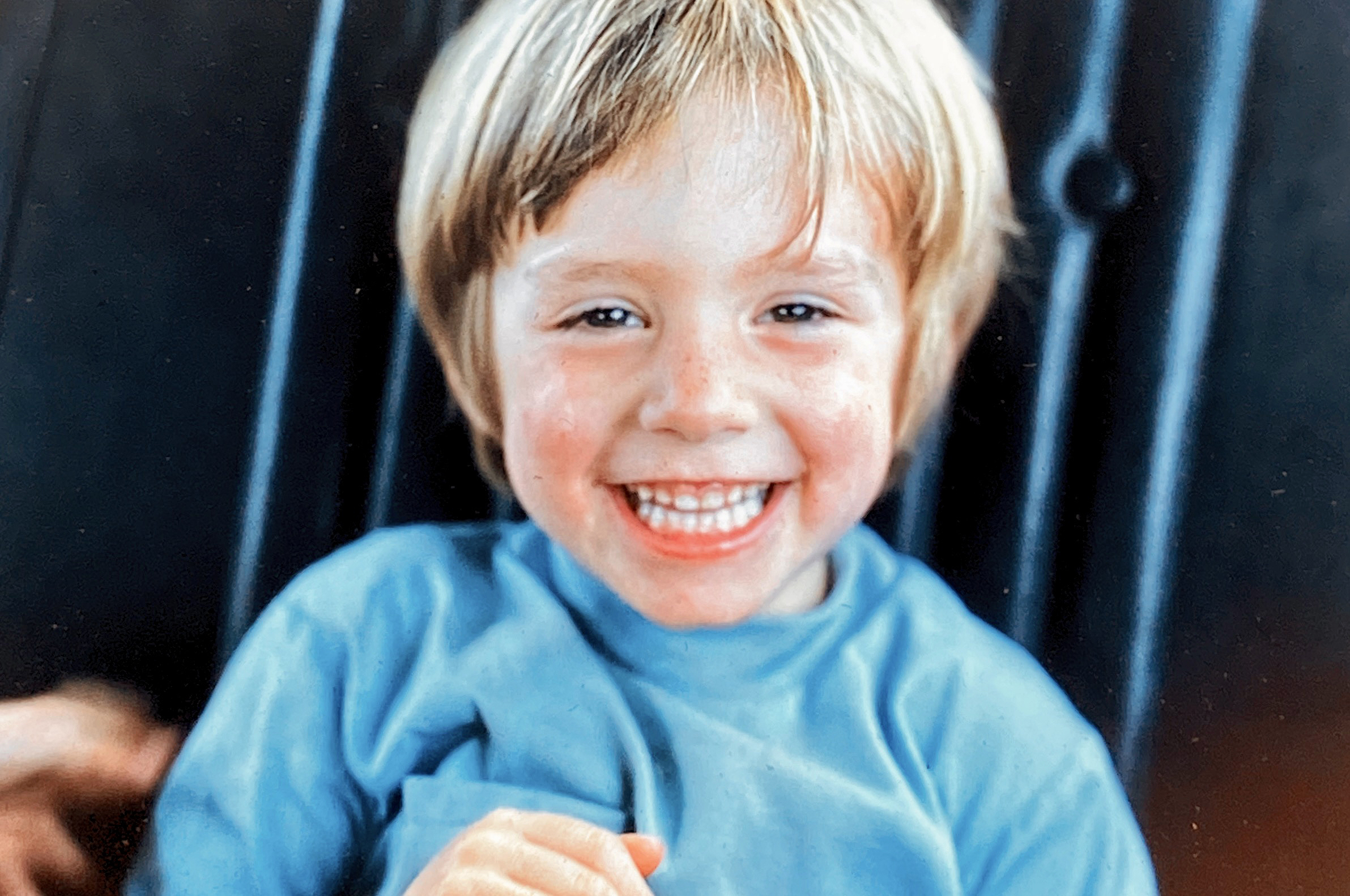 Young Robbie George portrait representing early life, memory, and the personal foundations that shaped resilience and way of seeing