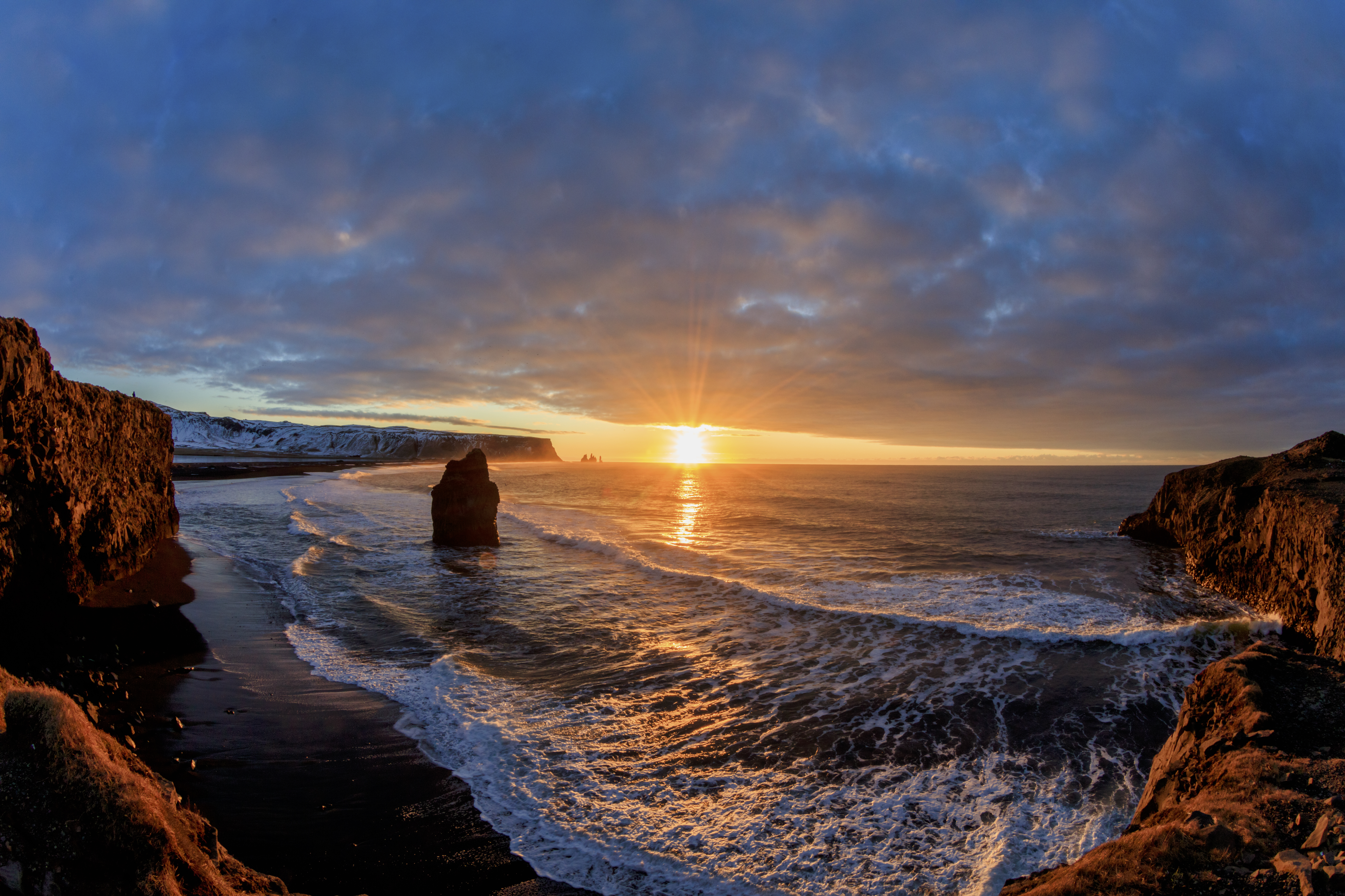 Sun blazing over black sand beach — symbol of soul illumination and midsummer awakening | Black Sand Beach | Robbie George Photography