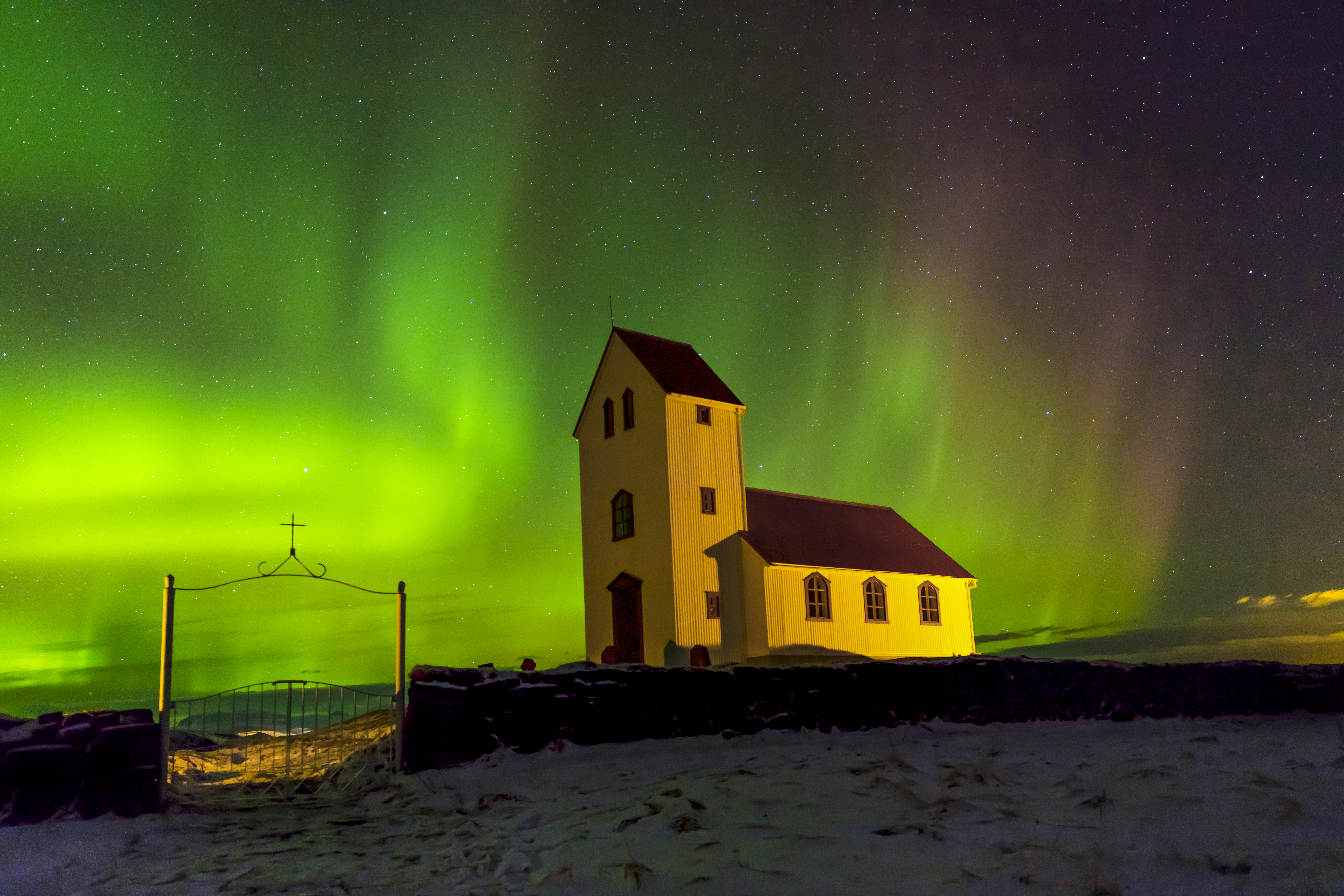 Aurora Borealis over a church in Iceland — symbol of hydrogen’s vibrational light